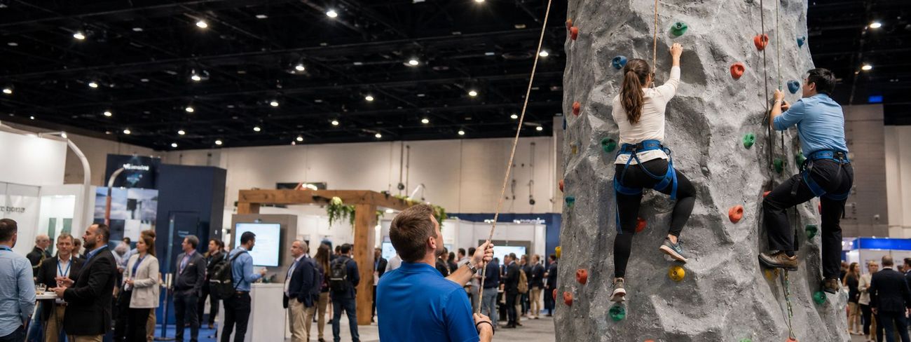 Mobile climbing wall set up indoors at a corporate conference